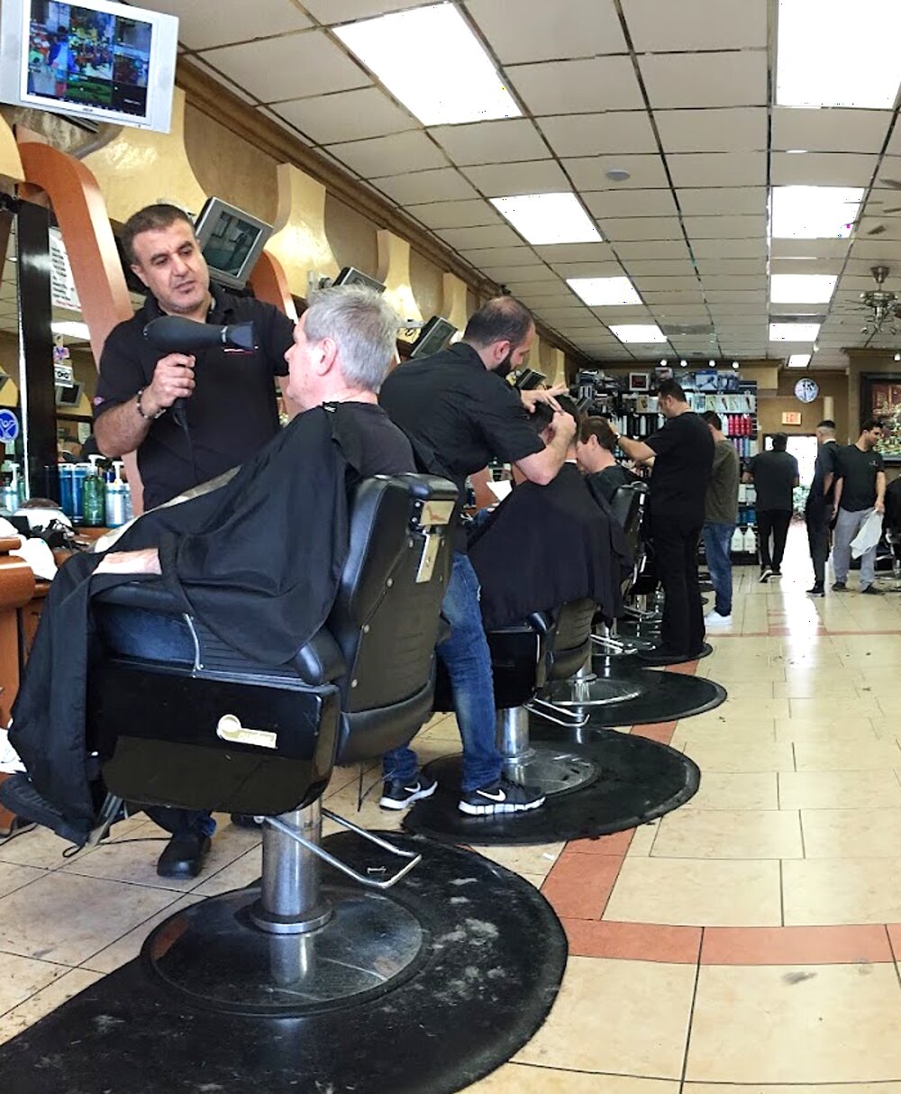 Barbers working the chairs at Mr Cut in El Cajon on a busy afternoon